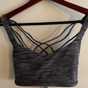 Lululemon strappy sports bra. Size 10. Black with shadow stripes.